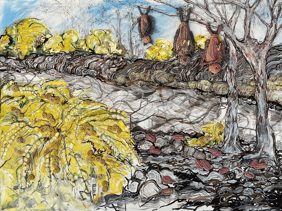 Virginia Keft_Birthday yellow_wattle on Country, mixed media piece featuring 3 woven flying foxes hanging from a tree, the background shows yellow wattle bushes and a rocky grey and red surface