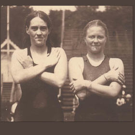 Sepia image of two women in swimming costumes