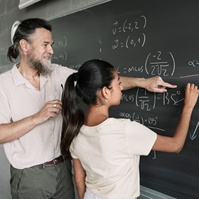 Female Teenager Student doing Maths Geometry Exercises on Blackboard