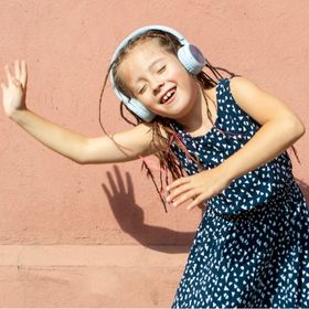 Girl dancing to a silent dance party 