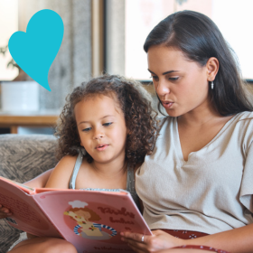 Mother reading with young daughter