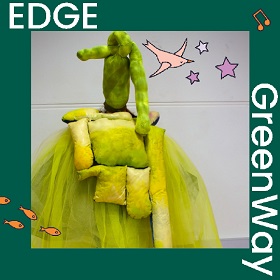 Photo of a yellow and green sculptural type work with a yellow-green neon tulle, overlayed is a stuffed yellow fabric of varying sixes, above this is a more green stuffed material which looks like stuffed stocking