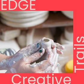 Promotional image for the Sensory Tour at Creative Trails, photo of two hands on a pottery wheel creating a vase like shape