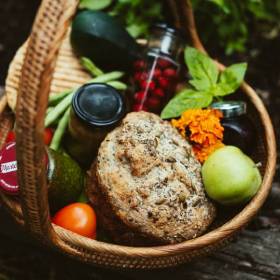 Fresh food and muffin in a cane basket