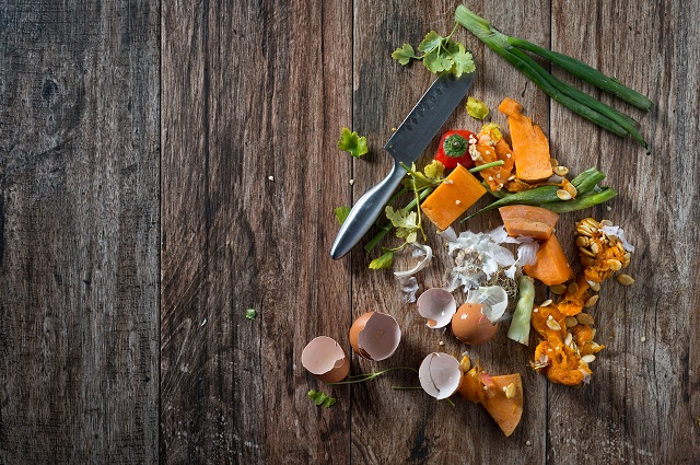 Chopping board with vegetables and knife