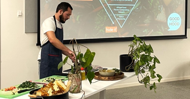 Man preparing food at a large table