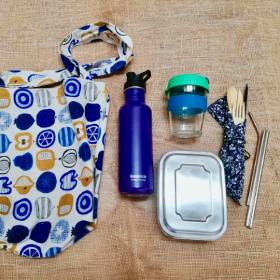 Cloth bag, water bottle, reusable cup, cutlery and straws