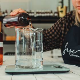 Large clear beaker with a woman\