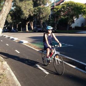 Woman cycling on a cycleway