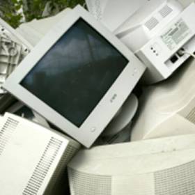 A pile of old computers and monitors