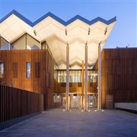 An Image of the Marrickville Pavilion lit up during the evening