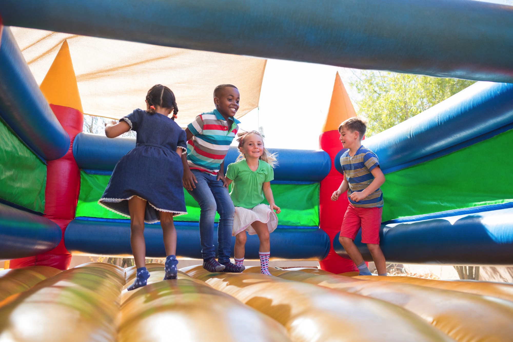 0_9282_13Nov2024120855_friends-playing-on-bouncy-castle-at-playground-2023-11-27-05-25-29-utclow.jpg