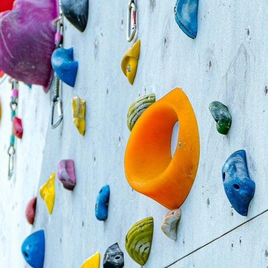 Colourful indoor rock-climbing wall 