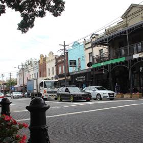 Street view of a pub and cars