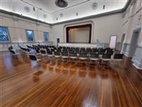 Overlooking to the stage, with chairs set up