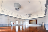 A view of the hall, including ceiling, main entrance, stage.