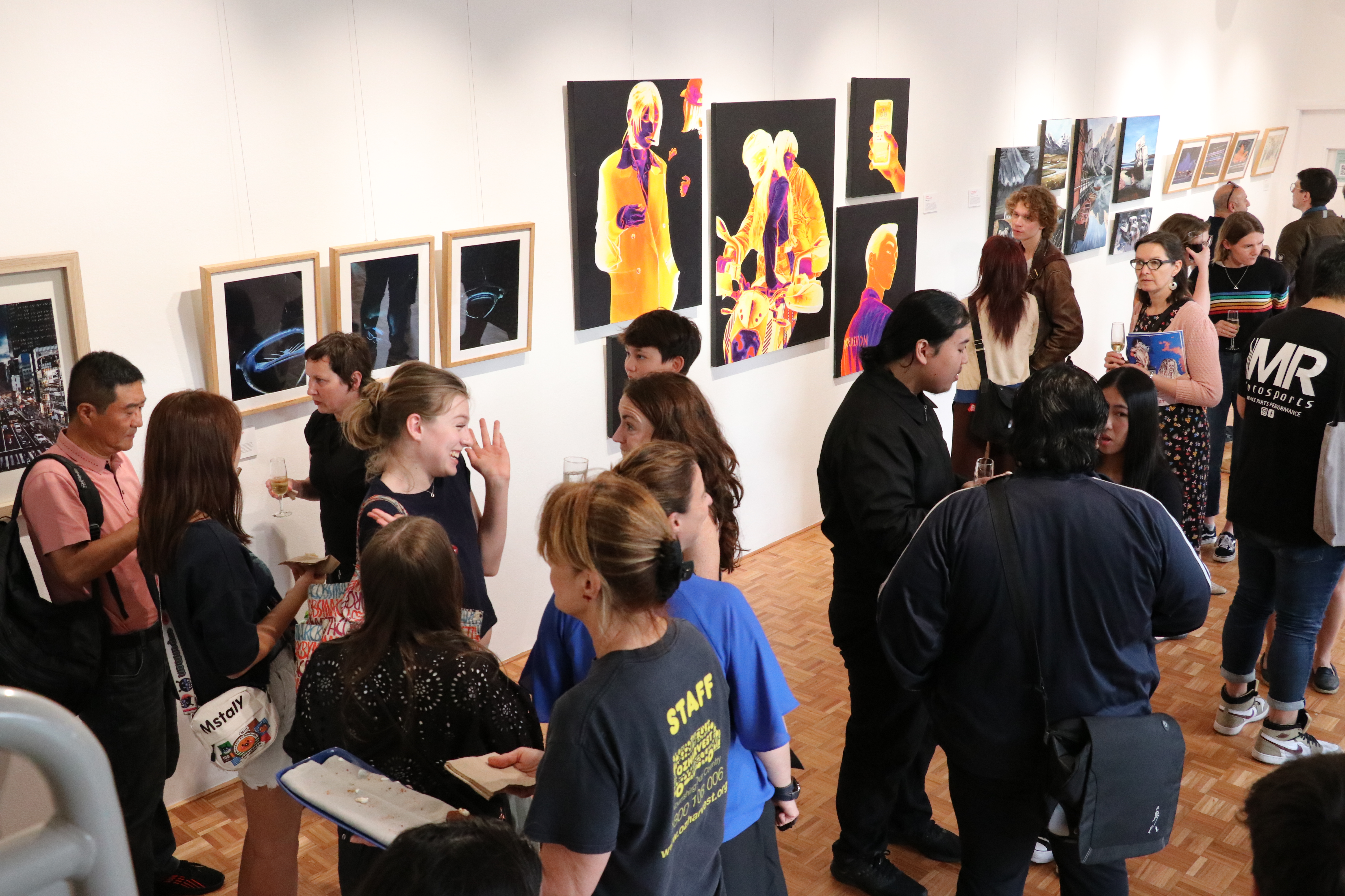 An art gallery filled with people