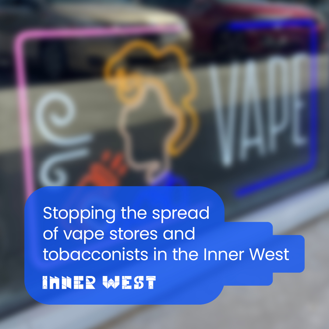 A blurred oout image of a vape store shop window. White text is a blue box shaped like a vape pen reads: Stopping the spread of vape stores and tobacconists in our community