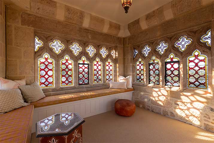 an image of a room with circle pattern shape windows